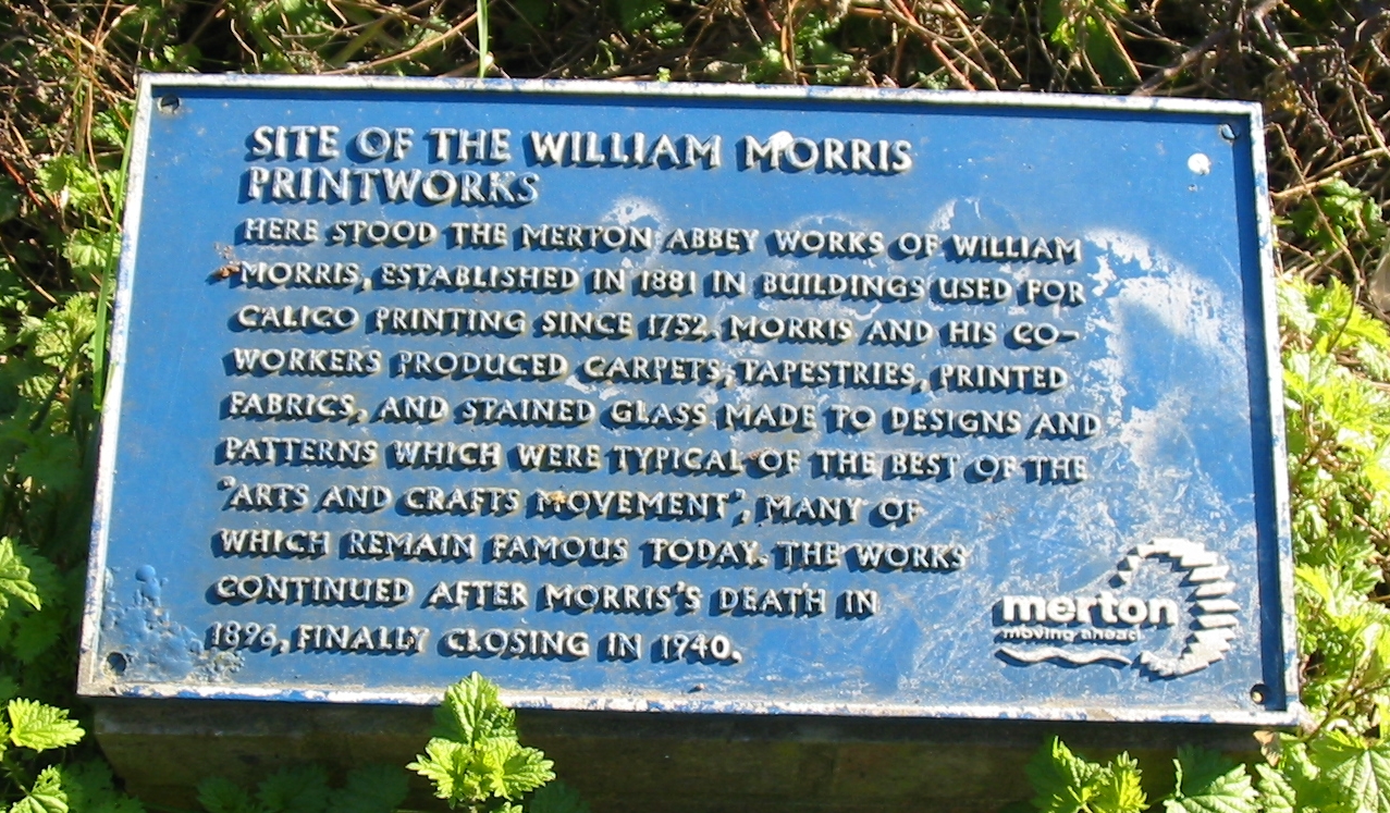 William Morris blue plaque - Site of the William Morris Printworks Here stood the Merton Abbey works of William Morris, established in 1881 in buildings used for calico printing since 1752. Morris and his co-workers produced carpets, tapestries, printed fabrics, and stained glass made to designs and patterns which were typical of the best of the 
