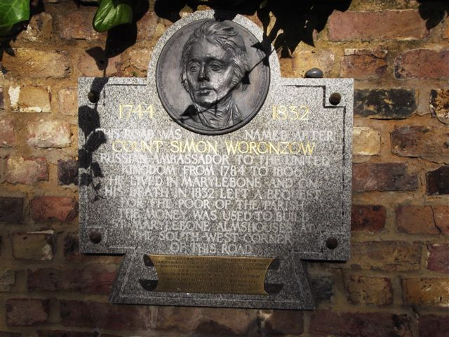 Simon Worcnzow stone plaque - 1744 1832 This road was named after Count Simon Worcnzow Russian Ambassador to the United Kingdom from 1784 to 1806 He lived in Marylebone and on his death in 1832 left a bequest for the poor of the parish The money was used to build St Marylebone Almshouses at the south-west corner of this road