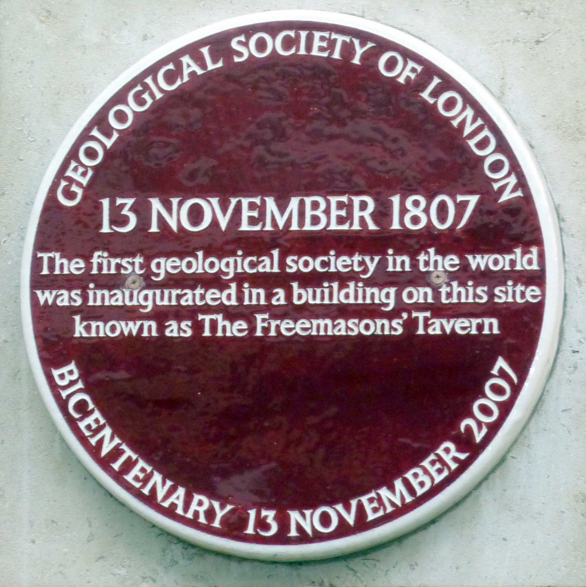 Geological Society of London purple plaque - 13 November 1807. The first geological society in the world was inaugurated in a building on this site known as The Freemasons' Tavern