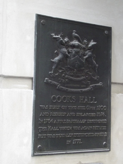 Cooks Hall bronze plaque - Cooks Hall    Was built on this site circa 1500  and rebuilt and enlarged 1674.  In 1764 a fire partially destroyed   the Hall which was again rebuilt   but was totally destroyed by fire in 1771.