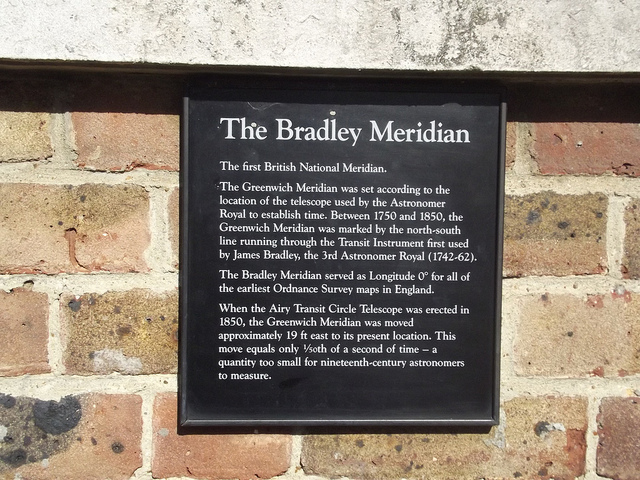 Bradley Meridian and James Bradley black plaque - The Bradley Meridian    The first British National Meridian    The Greenwich Meridian was set according to the  location of the telescope used by the Astronomer  Royal to establish time. Between 1750 and 1850, the  Greenwich Meridian was marked by the north-south line  running through the Transit Instrument first used  by James Bradley, the 3rd Astronomer Royal (1742-62).    The Bradley Meridian served as Longitude 0° for all of  the earliest Ordnance Survey maps of England.    When the Airy Tra