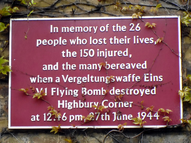 flying bomb (V1/V2) maroon plaque - In memory of the 26 people who lost their lives, the 150 injured, and the many bereaved when a Vergeltungswaffe Eins V1 Flying Bomb destroyed Highbury Corner at 12.46pm, 27th June, 1944