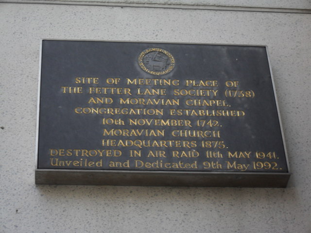 Black plaque № 3954 - Site of meeting place of the Fetter Lane Society (1758) and Moravian Chapel. Congregation established 10th November 1742.  Moravian Church headquarters 1875.   Destroyed in air raid 11th May 1941. 