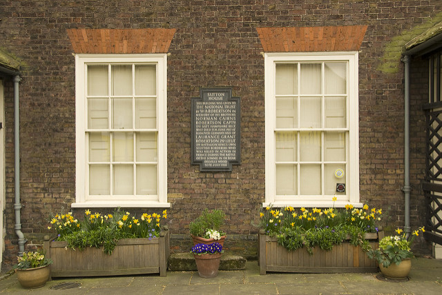 Sutton House black plaque - Sutton House  This building was given to the National Trust by W.A. Robertson in memory of his brothers Norman Cairns Robertson Captn 2nd Batt. Hampshire Regt. Who died 20th June 1917 at Hanover Germany and of Laurence Grant Robertson 2nd Lieut 2nd Battalion King's Own Scottish Borderers who was killed in action in France during the battle of the Somme in or near Delville Wood 30th July 1916