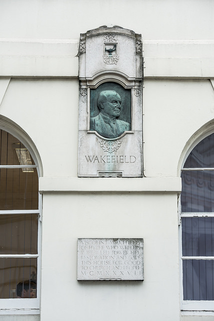 Charles Wakefield white plaque - Viscount Wakefield of Hythe who with his wife led Tower Hill restoration and gave this house for good to the church and people MCMXXXVII