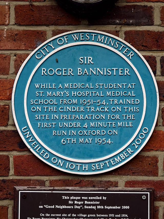 Roger Bannister blue plaque - Sir Roger Bannister while a medical student at St. Mary’s Hospital Medical School from 1951-54, trained on the cinder track on this site in preparation for the first under 4 minute mile run in Oxford on 6th May 1954.