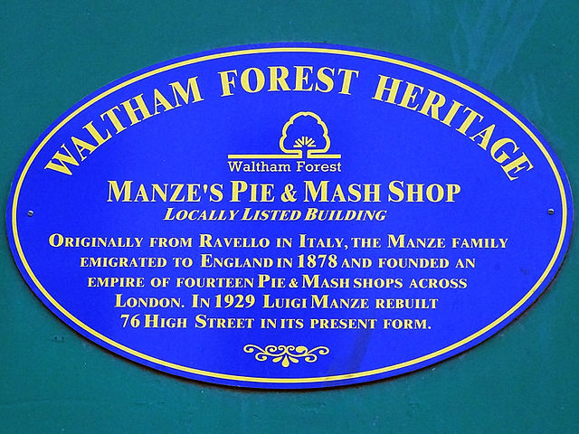 Luigi Manze blue plaque - Manze's Pie & Mash Shop.  Locally listed building.  Originally from Ravello in Italy, the Manze family emigrated to England in 1878 and founded an empire of fourteen pie & mash shops across London. In 1929 Luigi Manze rebuilt 76 High Street in its present form.
