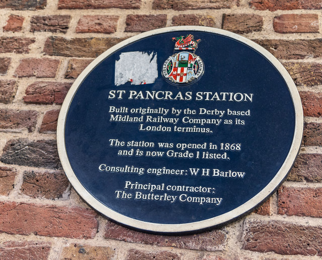 St Pancras railway station, London blue plaque - St Pancras Station  Built originally by the Derby based Midland Railway Company as its London terminus.  The station was opened in 1868 and is now Grade 1 listed.  Consulting engineer: WH Barlow  Principal contractor: The Butterley Company