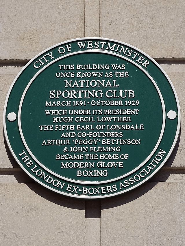 Green plaque № 42568 - This building was once known as The National Sporting Club March 1891-October 1929 which under its president Hugh Cecil Lowther the Fifth Earl of Lonsdale and co-founders Arthur 'Peggy' Bettinson and John Fleming became the home of modern glove boxing