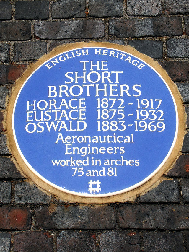 Horace Short, Eustace Short, and Oswald Short blue plaque - The Short Brothers Horace 1872-1917 Eustace 1875-1932 Oswald 1883-1969 aeronautical engineers worked in arches 75 and 81