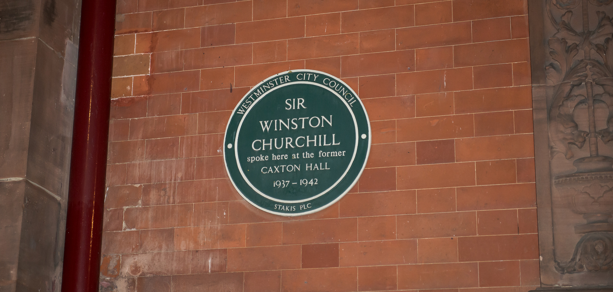 Winston Churchill green plaque - Sir Winston Churchill spoke here at the former Caxton Hall 1937-1942