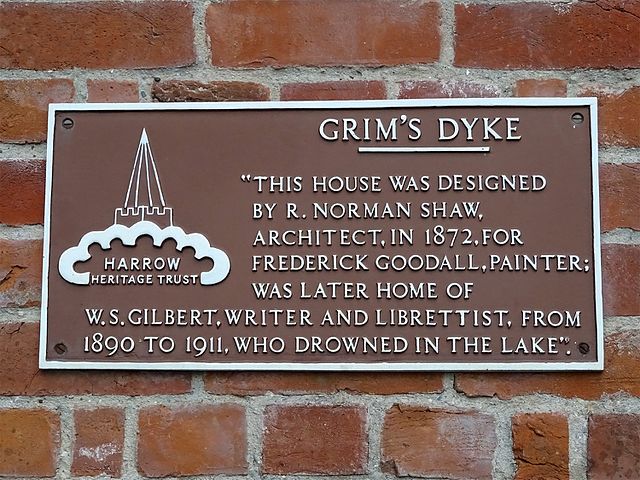 Richard Norman Shaw, Frederick Goodall, and W. S. Gilbert brown plaque - Grim's Dyke. This house designed by R. Norman Shaw Architect, for Frederick Goodall Painter was later the home of W. S. Gilbert Writer and librettist, from 1890 to 1911, who drowned in the lake.