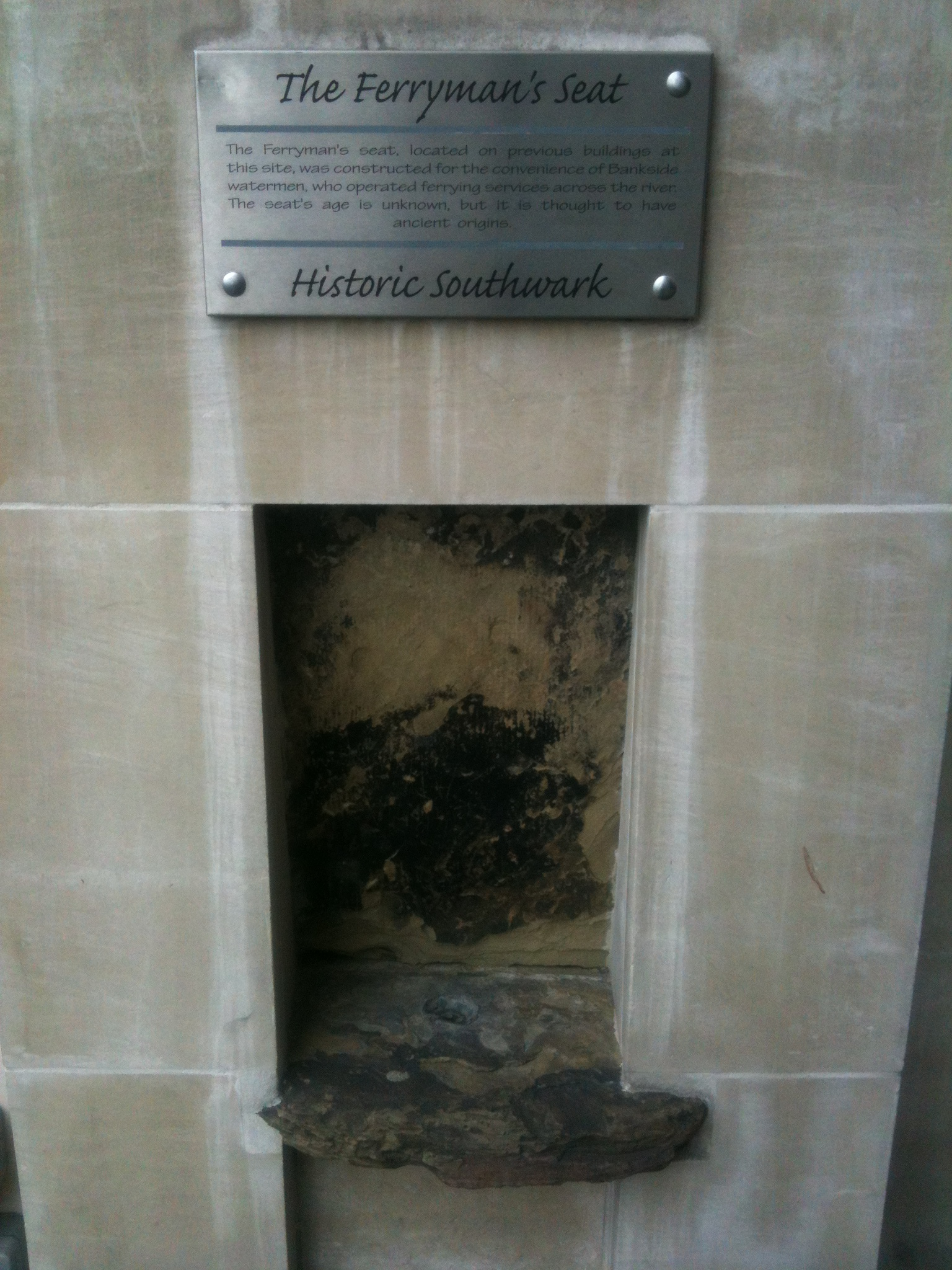 Ferryman's Seat brushed metal plaque - The Ferryman's Seat, located on previous buildings at this site, was constructed for the convenience of Bankside watermen, who operated ferrying services across the river. The seat's age is unknown, but it is thought to have ancient origins.