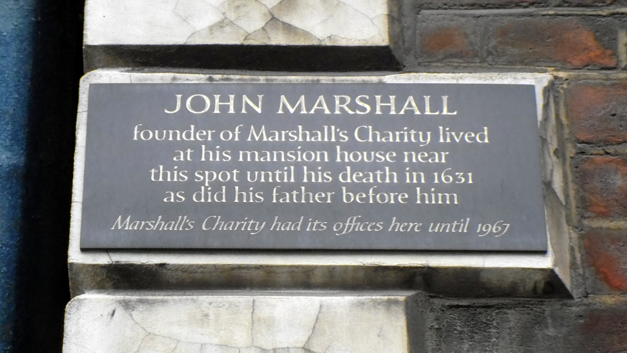 John Marshall and Marshall's Charity black plaque - John Marshall founder of Marshall's Charity lived at his mansion house near this spot until his death in 1631 as did his father before him. Marshall's Charity had its offices here until 1967