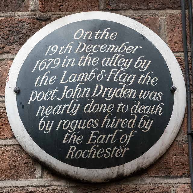 John Dryden black plaque - On the  19th December  1679 in the alley by  the Lamb & Flag the  poet John Dryden was  nearly done to death  by rogues hired by  the Earl of Rochester