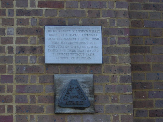 University of London stone plaque - The University of London hereby records its sincere apologies that the plans for this building were settled without due consultation with the Russell family and their trustees and therefore without their approval of its design