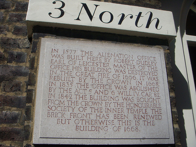 Robert Dudley and Alienation Office stone plaque - In 1577 The Alienation Office was built here by Robert Dudley Earl of Leicester Master of the Office. His building was destroyed in the Great Fire of 1666. It was rebuilt by the Crown in 1668. In 1835 the Office was abolished by the Act 5 and 6 Will. IV. Cap. 82. In 1842 the building was bought from the Crown by the Honourable Society of the Inner Temple. The brick front as been renewed but otherwise this is the building of 1668.
