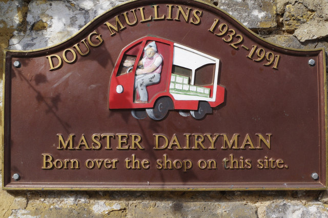 Doug Mullins brown plaque - Doug Mullins 1932-1991 Master Dairyman Born over the shop on this site.